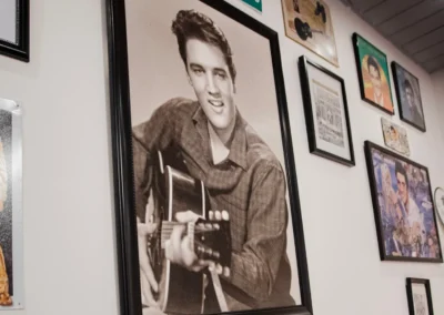 Wall of Elvis Presley photos and records in a diner